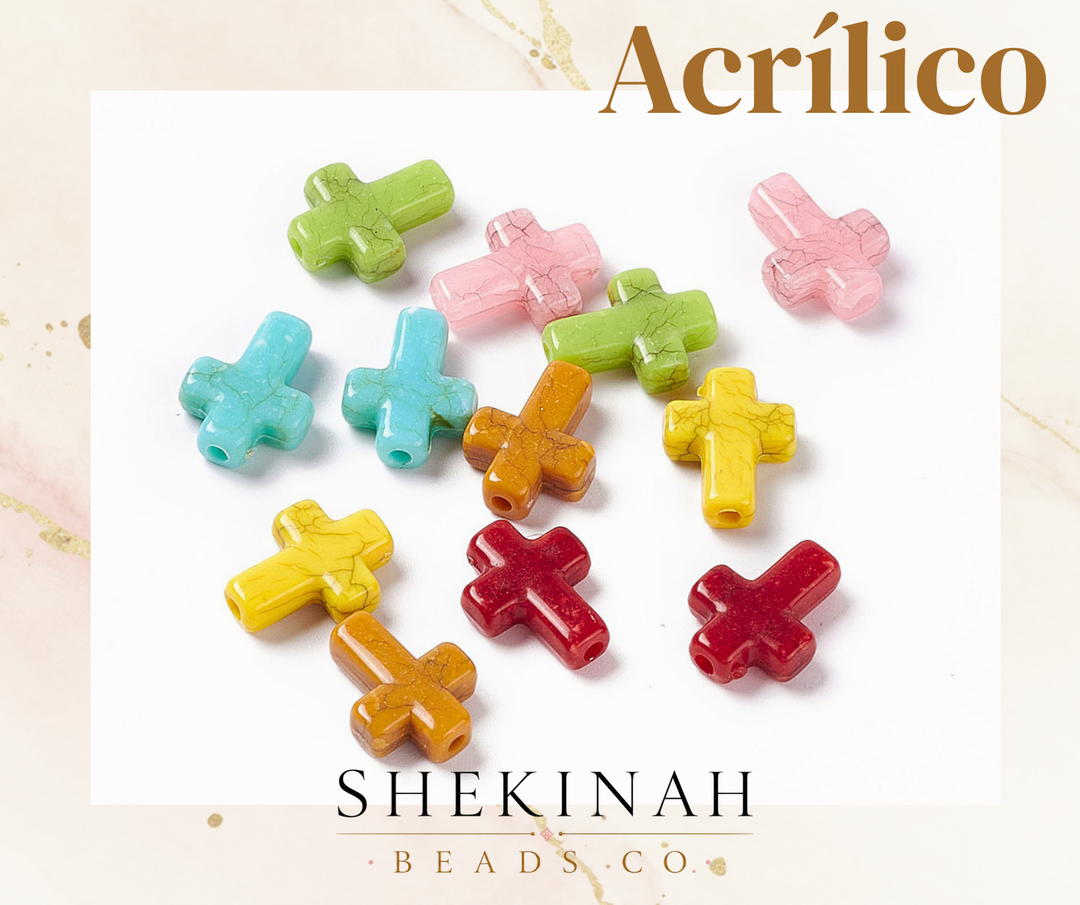 Beads acrílicos en forma de cruz con acabado marmoleado en colores surtidos.