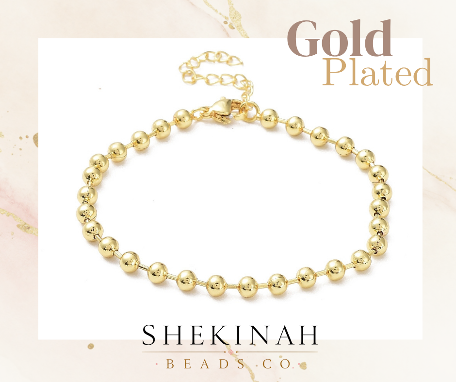 Base de pulsera dorada estilo gold plated con bolitas y extensión para bisutería