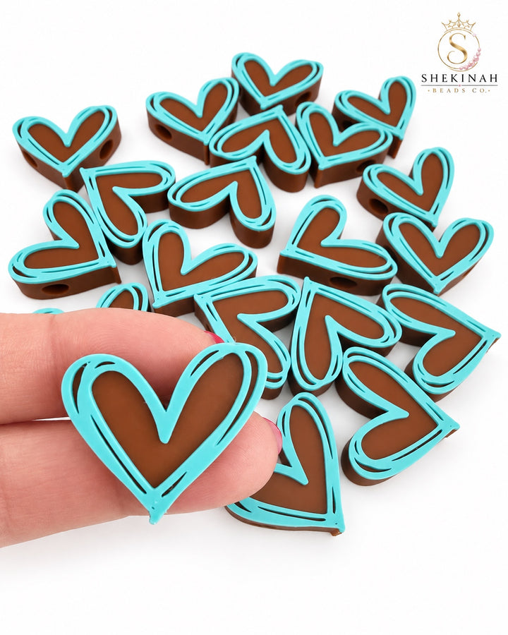 Bead 3D corazón marrón con borde turquesa, hueco horizontal de 5 mm