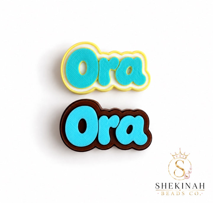 Ora Chunky Charm 3D en combinaciones amarillo, blanco, turquesa y brown